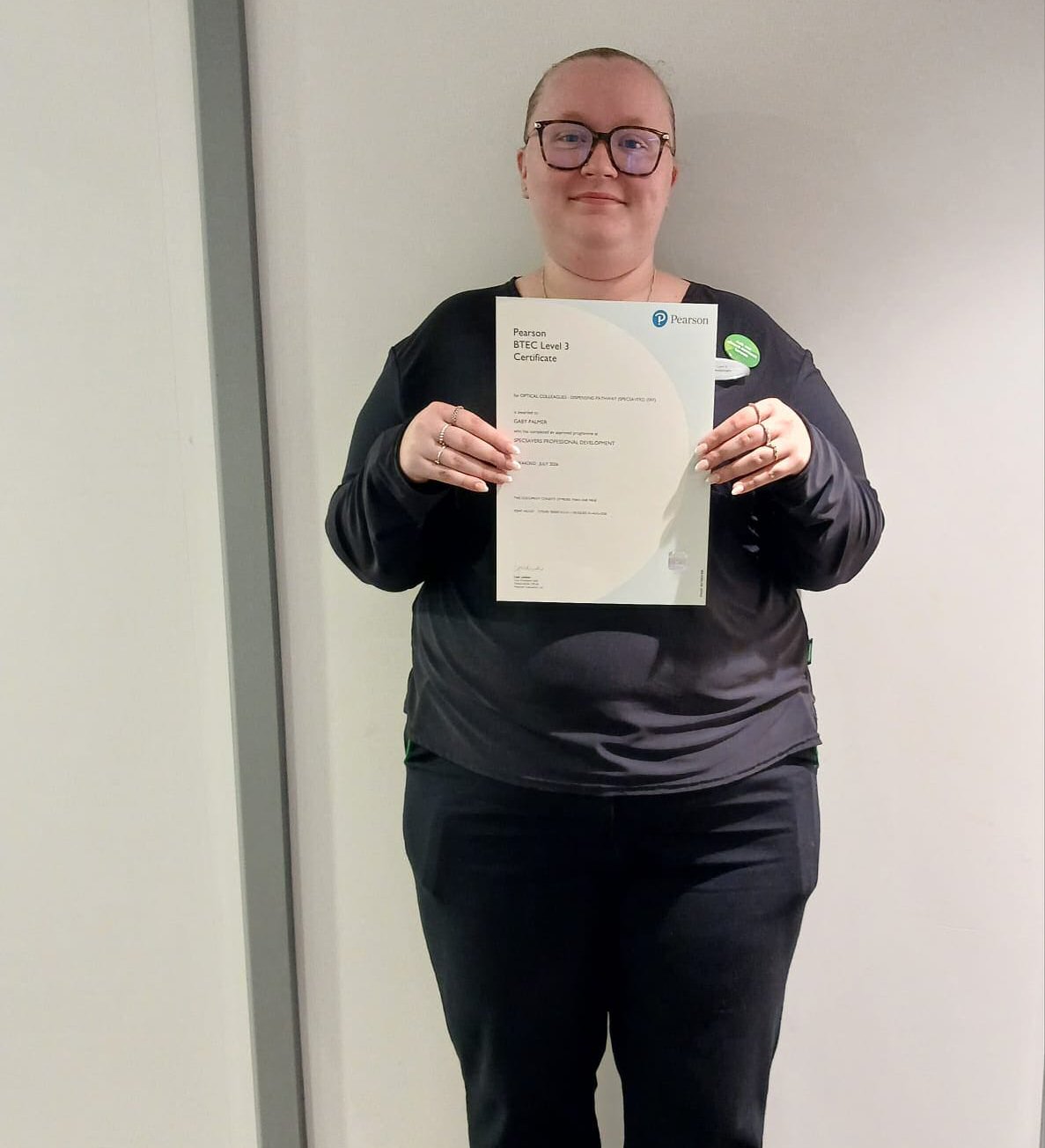 Local opticians celebrates colleague's qualification success